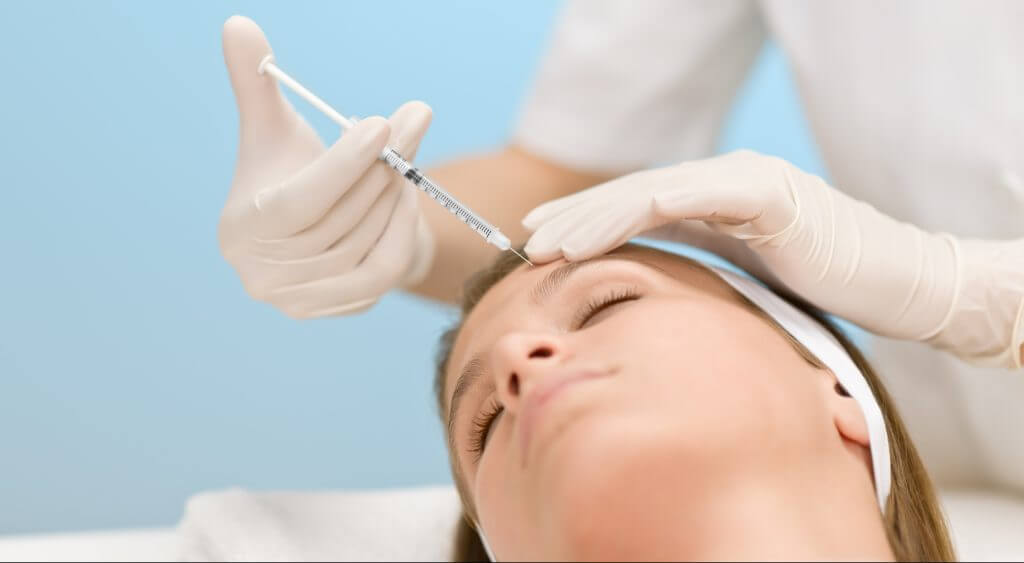 Botox injection – Woman in cosmetic medicine treatment